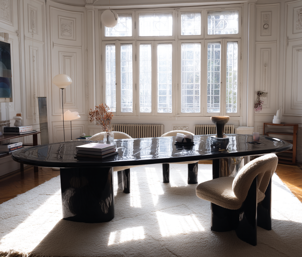 kakadigital_A_glossy_black_oval_dining_table_with_plush_spiritu_63879086-b108-47eb-91bd-276c5121401f